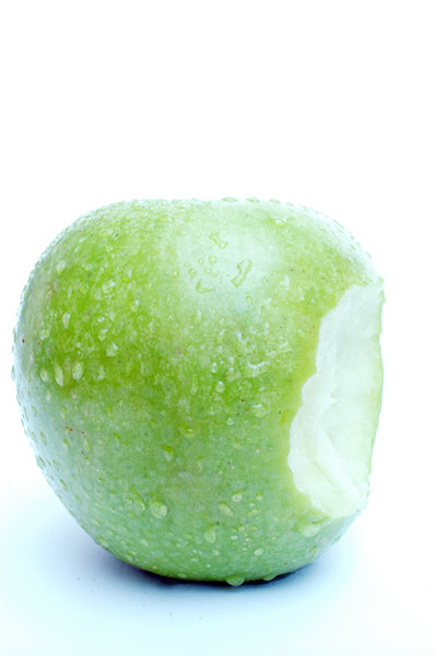 Apple with waterdrops and bite