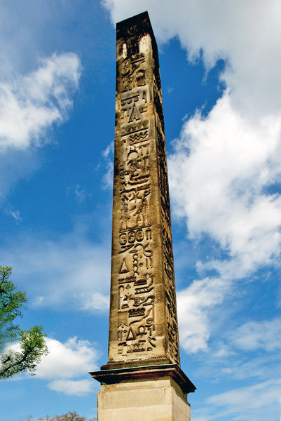 Clouds over ancient obelisk