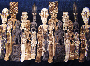 Tribal influence: Fabric border on one of my son's shirts.  Tribal statues