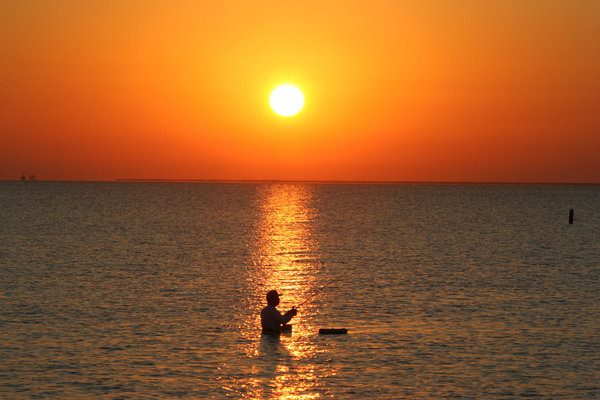 Sunrise with a Fisherman