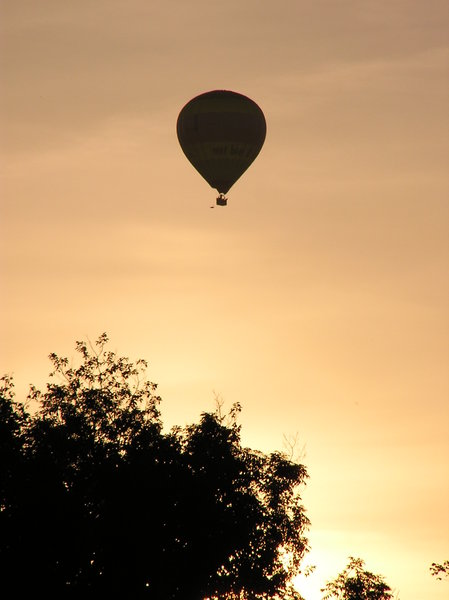Balloon against orange sky