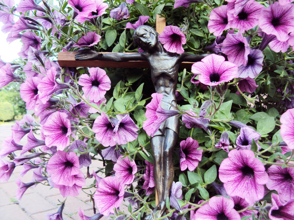 Crucifix with purple flowers