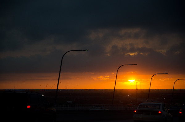 Sunset commute on a bridge