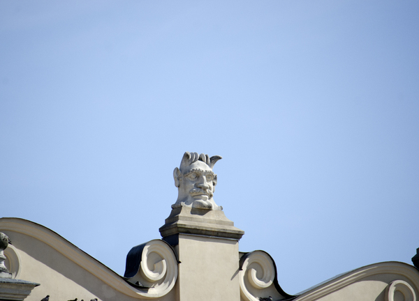 stone head on top of building