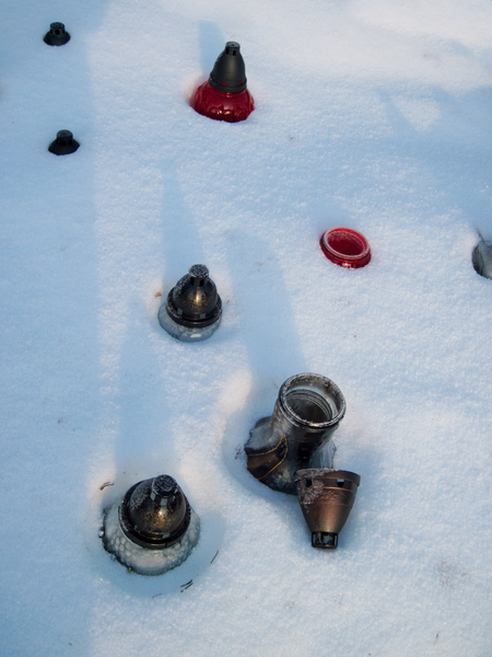 Grave candles in the snow