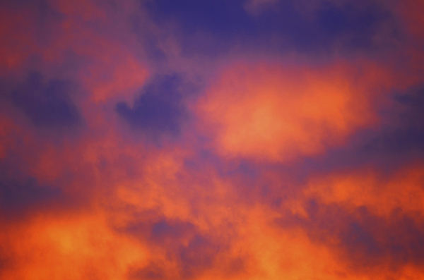 Fierce night clouds: Orange colored sunset clouds
