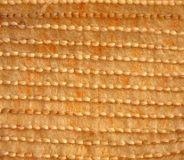 knitted tan floor mat
