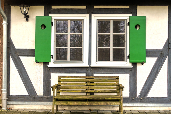 half-timbered house with bench