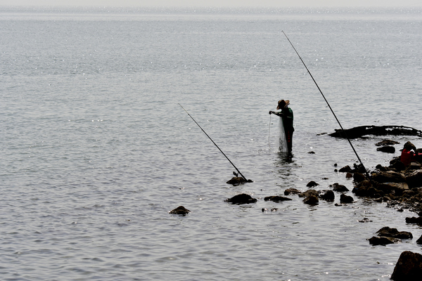 fishing with a rod from rocks