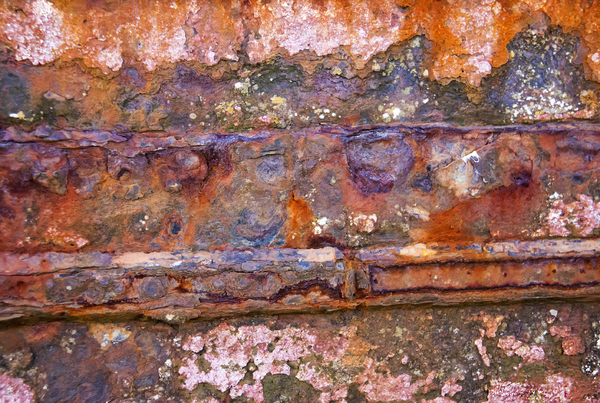Abandoned Boat Grunge: Detail of rusting hulk abandoned on a salt marsh.