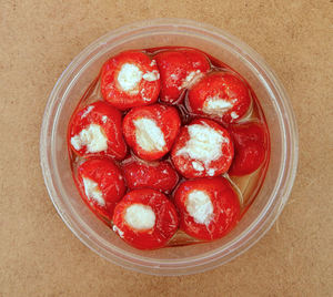 cheesy cherry peppers1a: small cheese stuffed red cherry peppers
