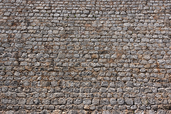 Stone wall background: Part of an old defensive stone wall in Ibiza, Spain.