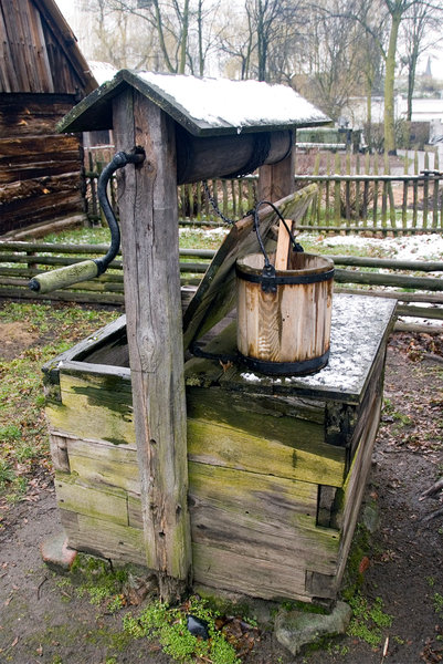 Country well: Old water well with crank drive