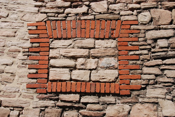 Old wall with blind window: Stone and brick wall texture