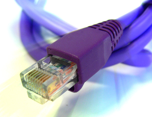 Ethernet cable: Rolled up network cable with a light glow.