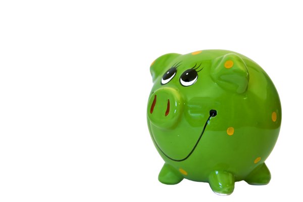 Green Piggy Bank: A colourful, smiley piggy bank.  Lots of copy space.