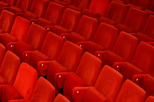Theatre Seats: Red seats in an empty theatre