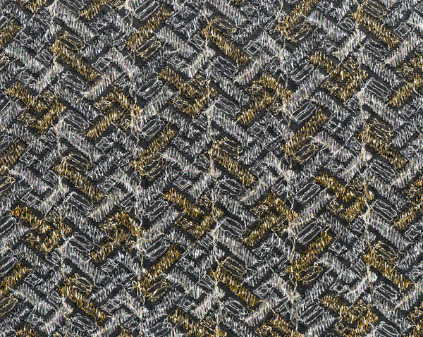 gold and white silver gauze fa: Patterned see through fabric on black background.  Gold and silver thread in a brick-like herringbone pattern