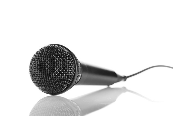 Microphone: an isolated microphone with reflection.