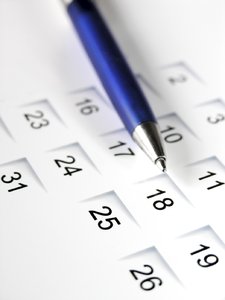 Pen on calendar: blue pen on a calendar sheet
