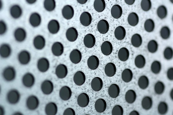 Mesh Holes Close-up: Steel mesh holes shot at close range.