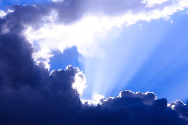 Clouds: Sun rays shining over clouds