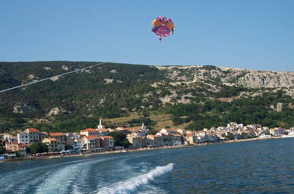 parasailing over town Baska
