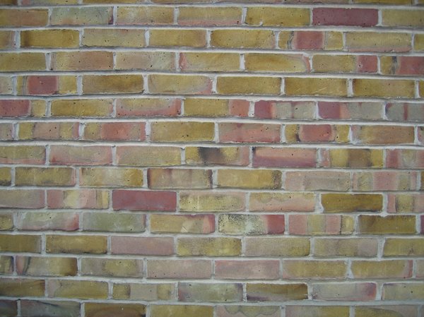 ochre coloured brick wall
