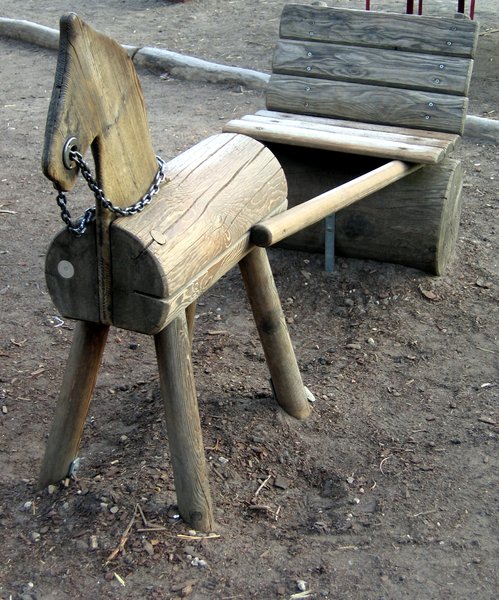 wooden pony on a playground
