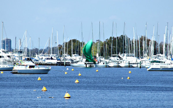 penned in: riverside marina with boat pens and many small yachts at anchor