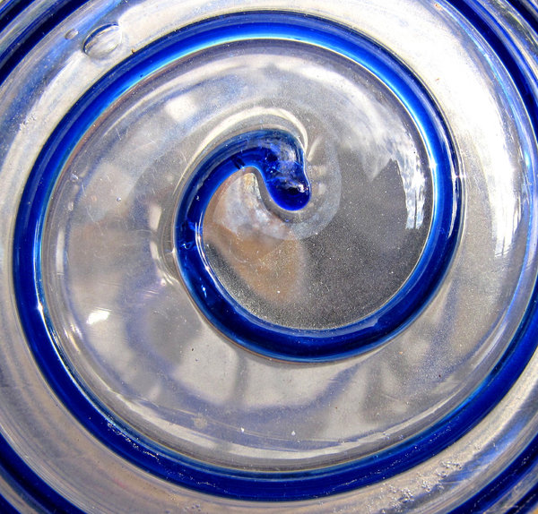 spiralling in blue: dusty outdoors glass garden ornament with blue spirals