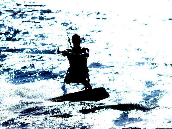 Kite surfer in backlight