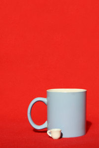 Mugs: Two mugs on the red background