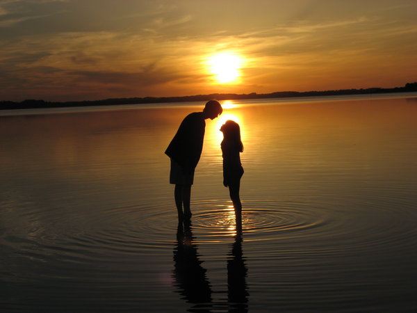 Kiss in the sunset: My two children playing