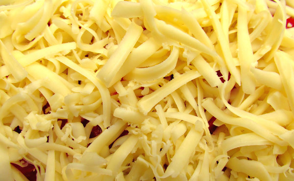 shredded cheese texture: curled strands of shredded cheese