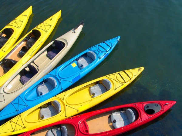 Kayaks ready for their riders: Colorful Kayaks waiting for their riders
