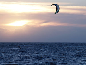 Kite surfer in backlight