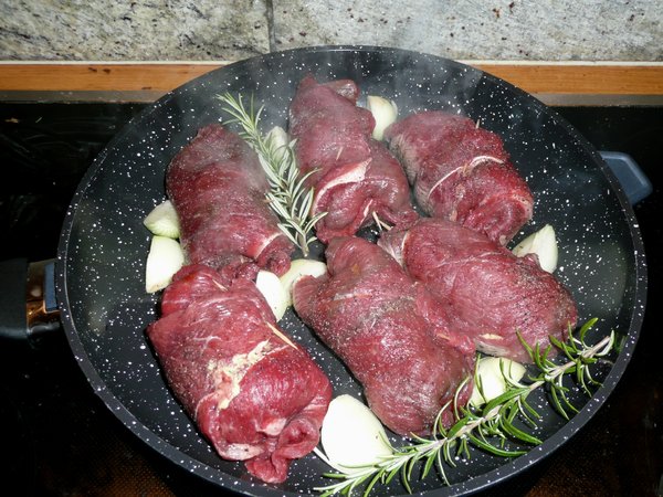 Cooking: Roasting, rolled beef in a pan