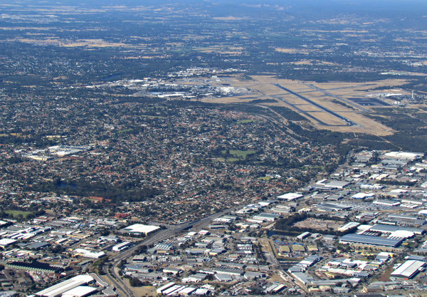 down in the suburbs: looking down on Australian suburbs through airplane window
