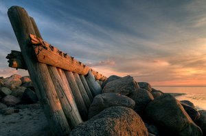 Breakwater - HDR: Breakwater and coastbarrier in evening light (sunset). The image is HDR.