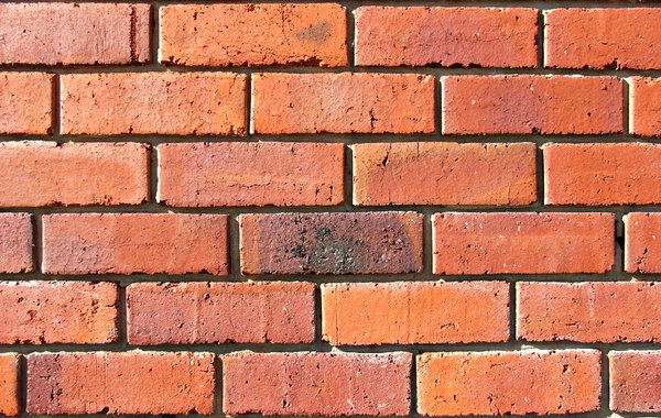 up against a brick wall