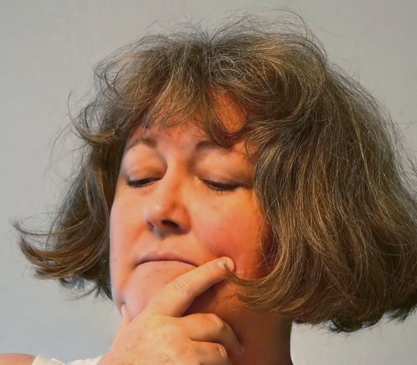 Depression: A woman with hand to her face, looking downward, with a depressed and worried expression. Similar pics here:
http://www.rgbstock.com/photo/dKTlvg/Regret
http://www.rgbstock.com/photo/2dyVNLI/Worry+1
A model release can be arranged if needed.