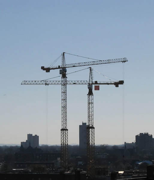 construction cranes: a pair of construction cranes near downtown minneapolis.