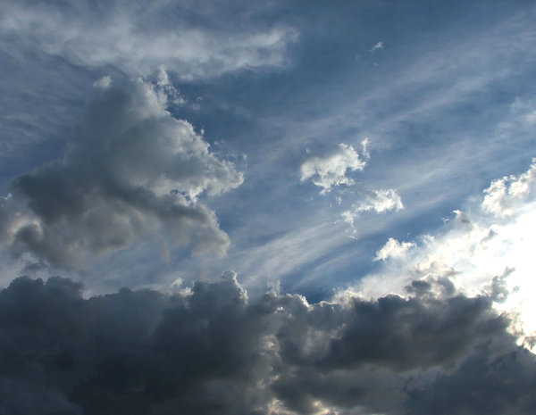 cloud contrast: several cloud layers with dark clouds and sunlight breaking through