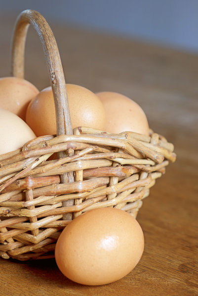 Egg basket: basket with brown organic eggs