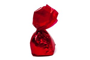 Bonbon: Chocolate bonbon in red wrapper.
