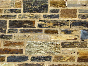 stone patchwork1: historic wall made up of patchwork of stone surfaces & types