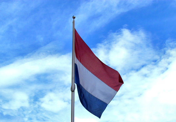 flag flying high1: Dutch flag flying high on flagpole