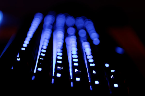 backlight keyboard: glowing keyboard in the dark, very shallow DOF