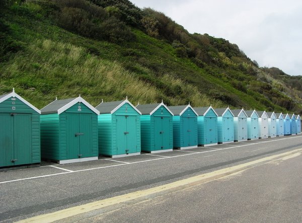 Beach huts: Multi-coloured beach huts along Bournemouth beach.